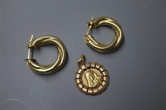 A pair of 18ct gold rope-twist hoop earrings and a two-colour 750 yellow metal Madonna pendant.